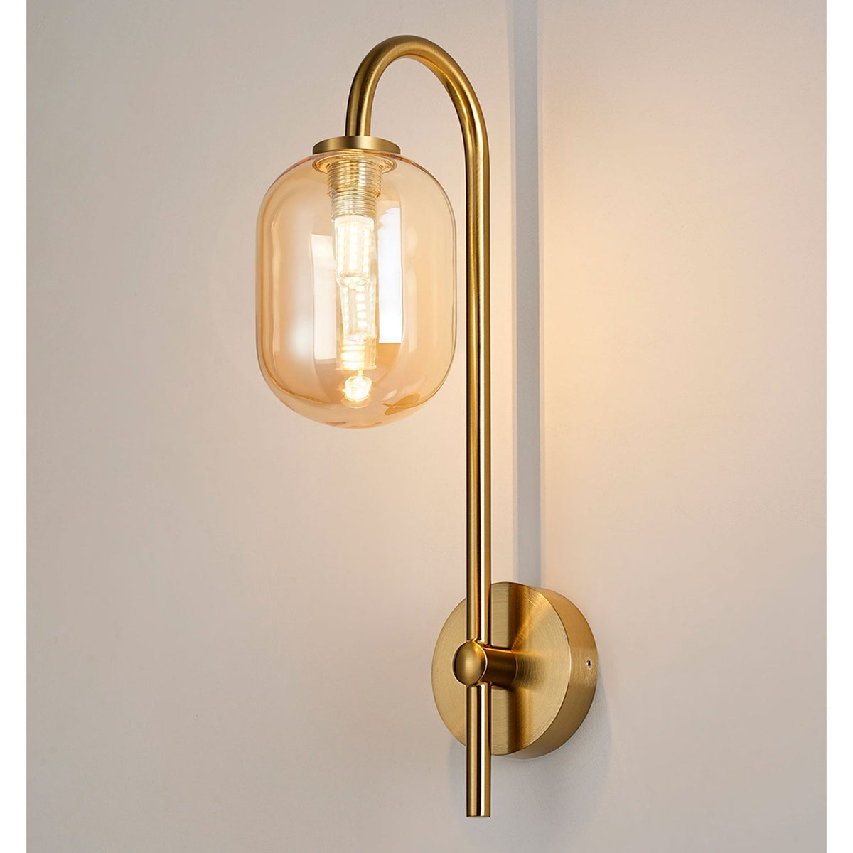 Tenterden Curved Arm IP44 Wall Light in Brass Gold with Smooth Tubular Amber Glass Diffuser
