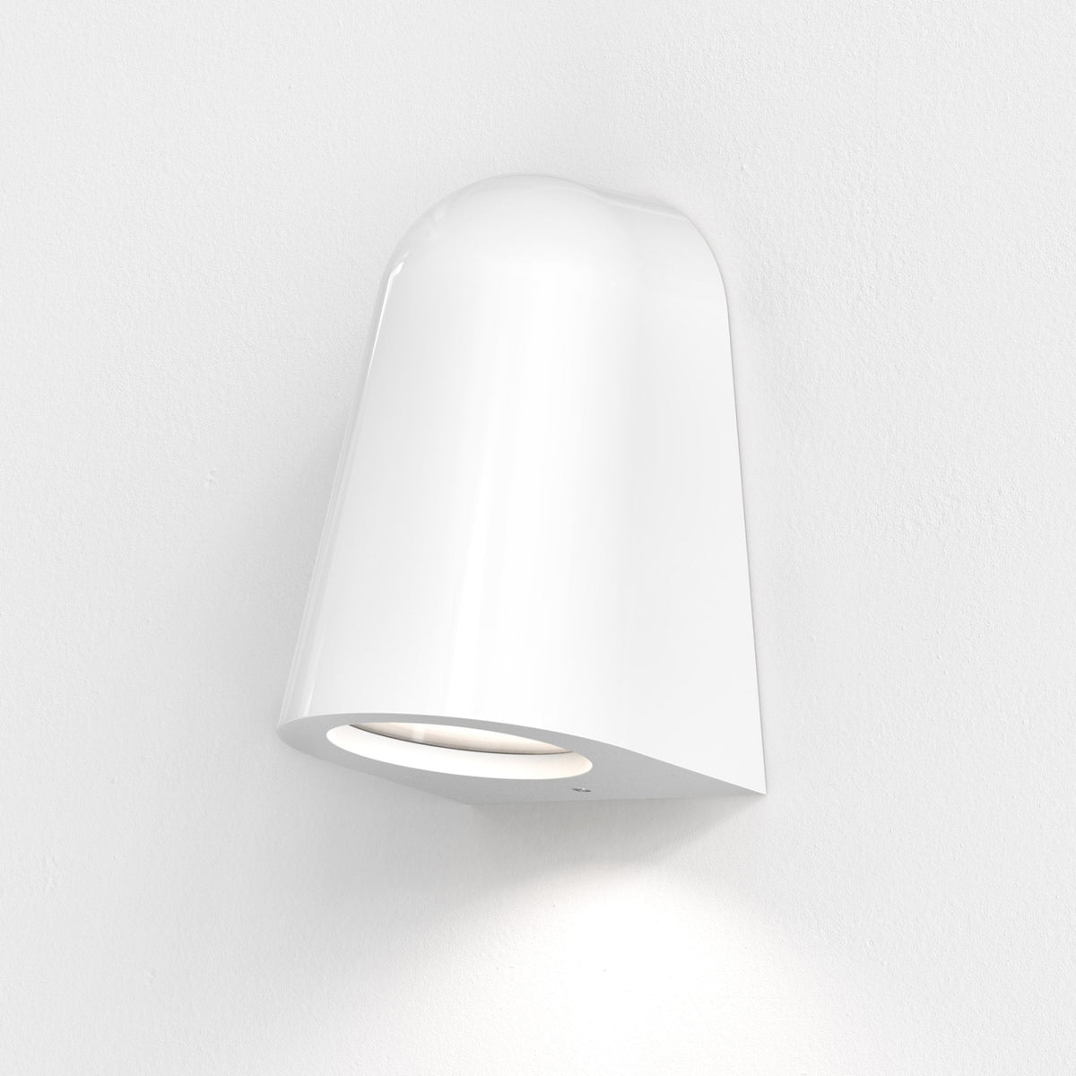 White wall light with a curved top and an oval opening at the bottom, casting light downwards on a white wall