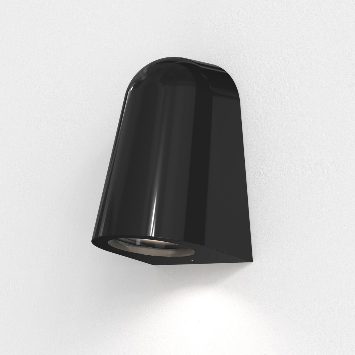 Black wall-mounted outdoor light with a rounded top and a flat bottom, illuminating the wall below