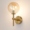 Tenterden Medium Arm IP44 Wall Light in Brass Gold with Smooth Round Amber Glass Diffuser