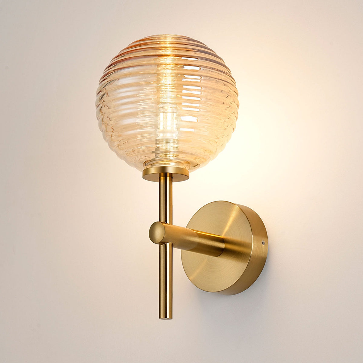 Tenterden Medium Arm IP44 Wall Light in Brass Gold with Ribbed Round Amber Glass Diffuser