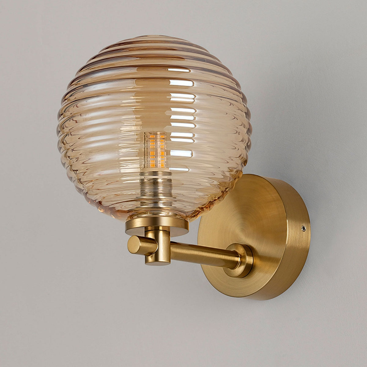 Tenterden Short Arm IP44 Wall Light in Brass Gold with Ribbed Round Amber Glass Diffuser