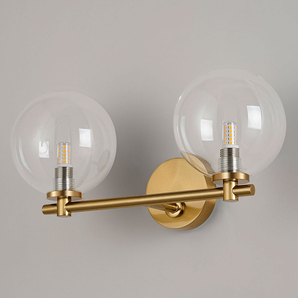 Tenterden Short Twin Arm IP44 Wall Light in Brass Gold with Smooth Round Clear Glass Diffusers