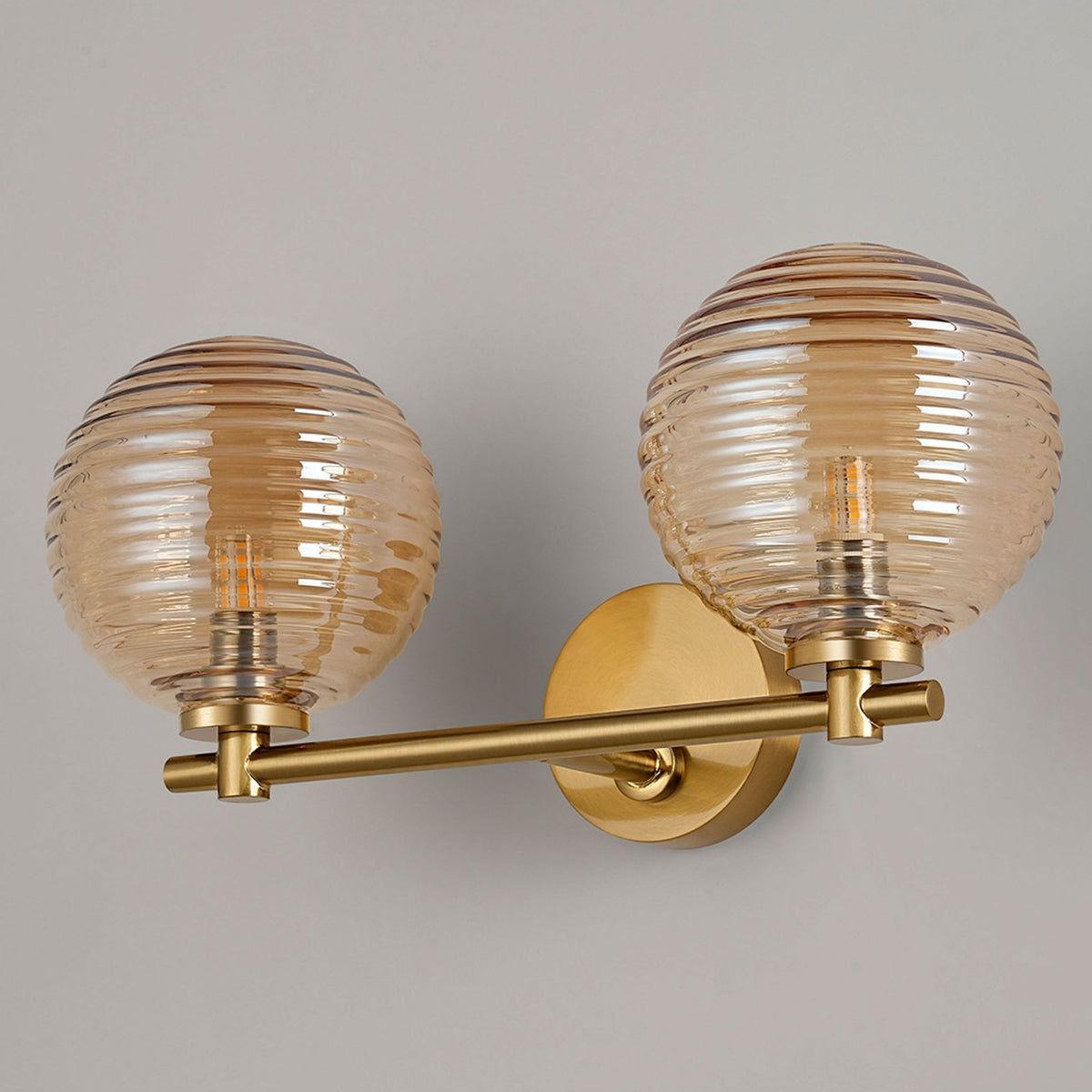 Tenterden Short Twin Arm IP44 Wall Light in Brass Gold with Ribbed Round Amber Glass Diffusers