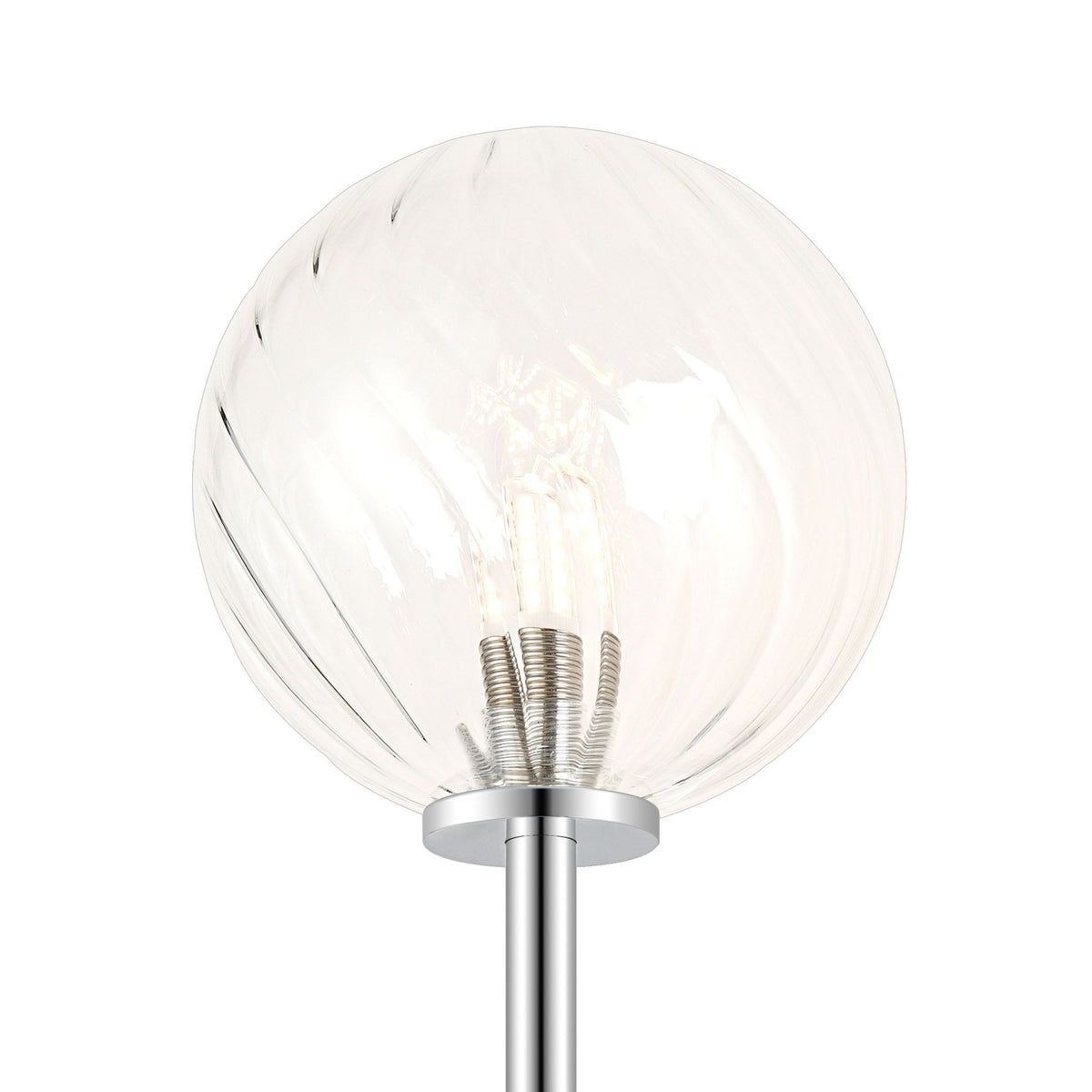 A close-up of the clear, swirled glass globe shade of a modern wall light, with bulb visible.