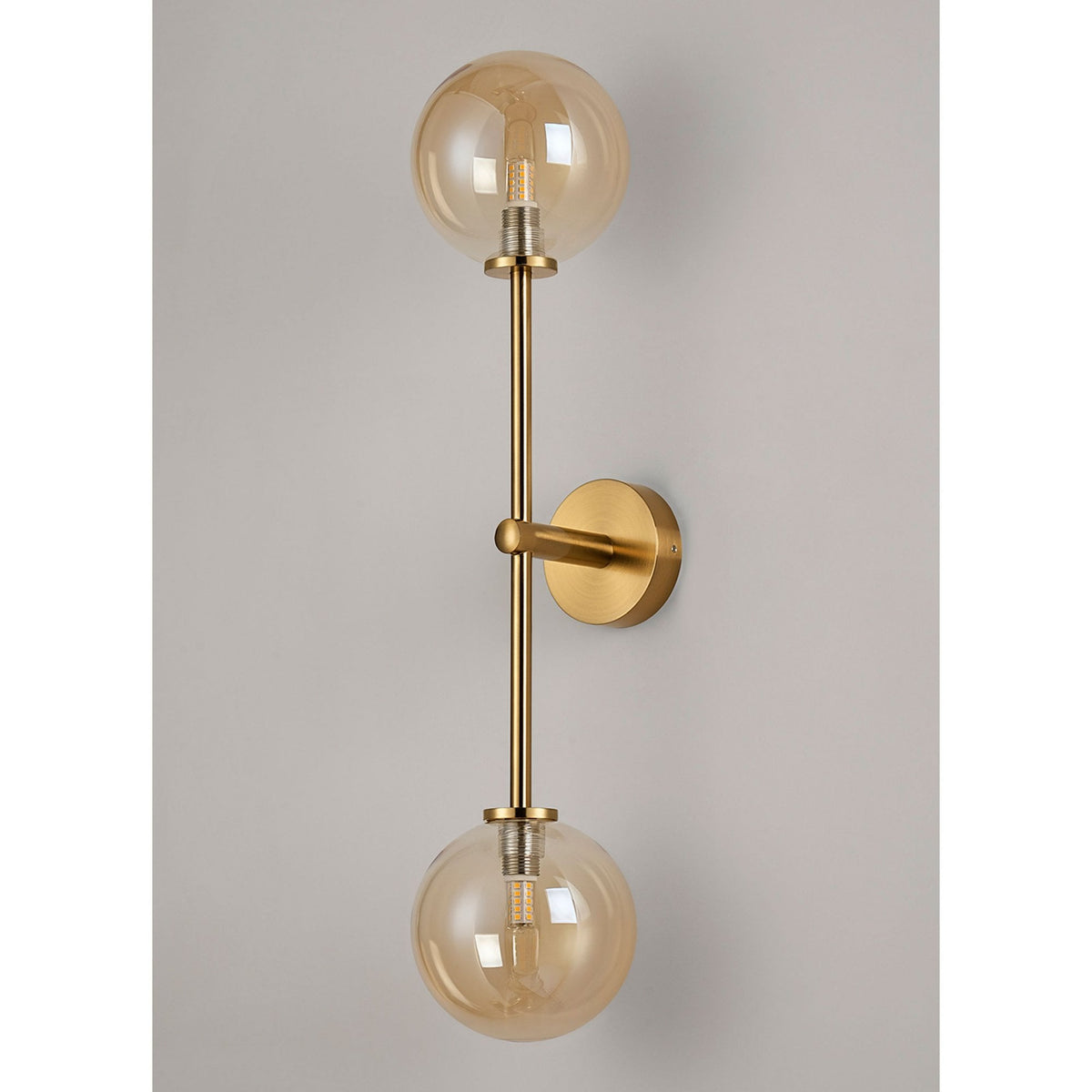 Tenterden Tall Twin Arm IP44 Wall Light in Brass Gold with Smooth Round Amber Glass Diffusers