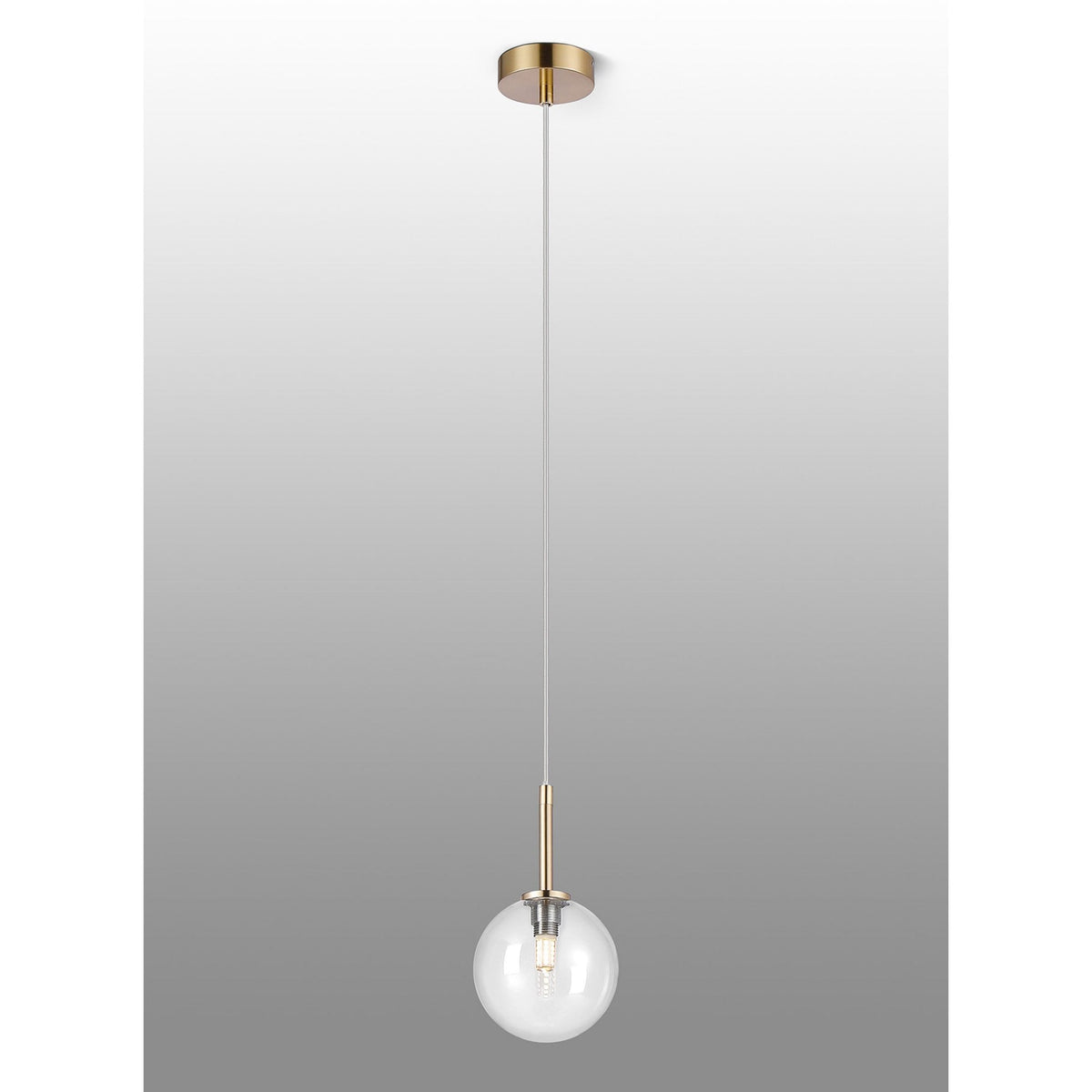 Full view of the gold and clear glass sphere pendant light against a gradient background.