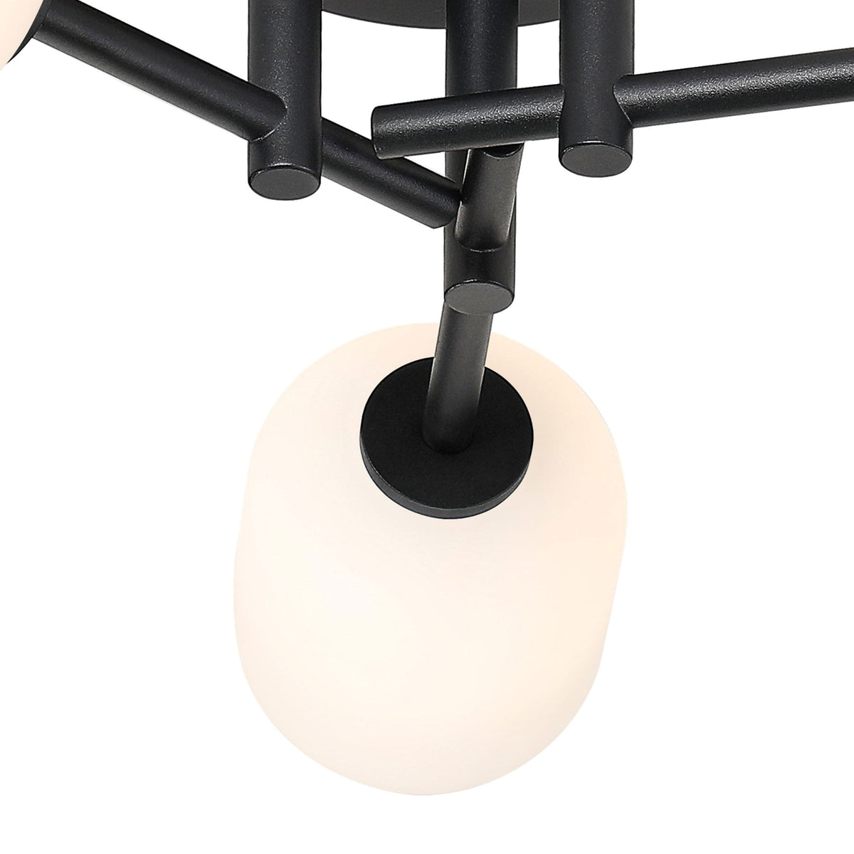 A close-up of one white oval glass shade on a black modern ceiling light.
