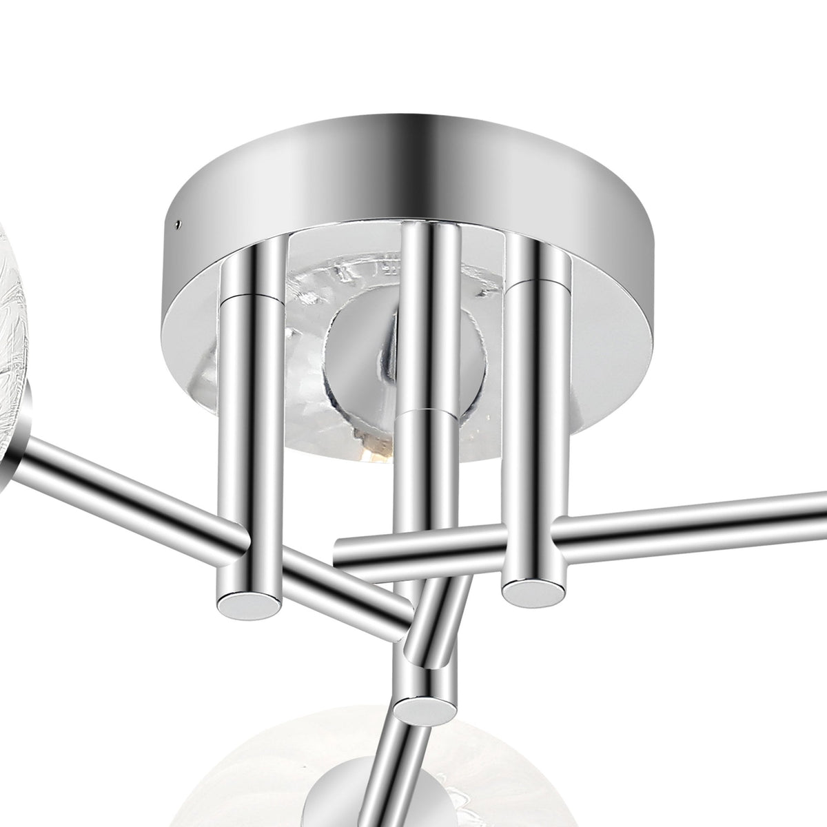 A close-up of the chrome base of a ceiling light with three glass orb shades.
