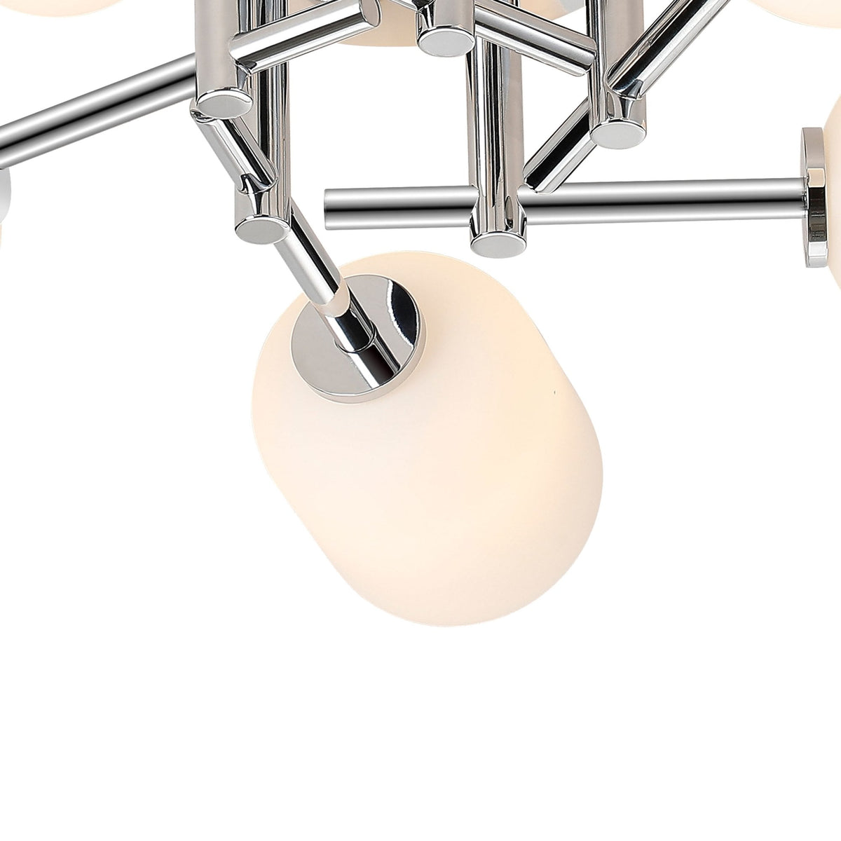 A detailed close-up of a single illuminated white glass shade and chrome arm.