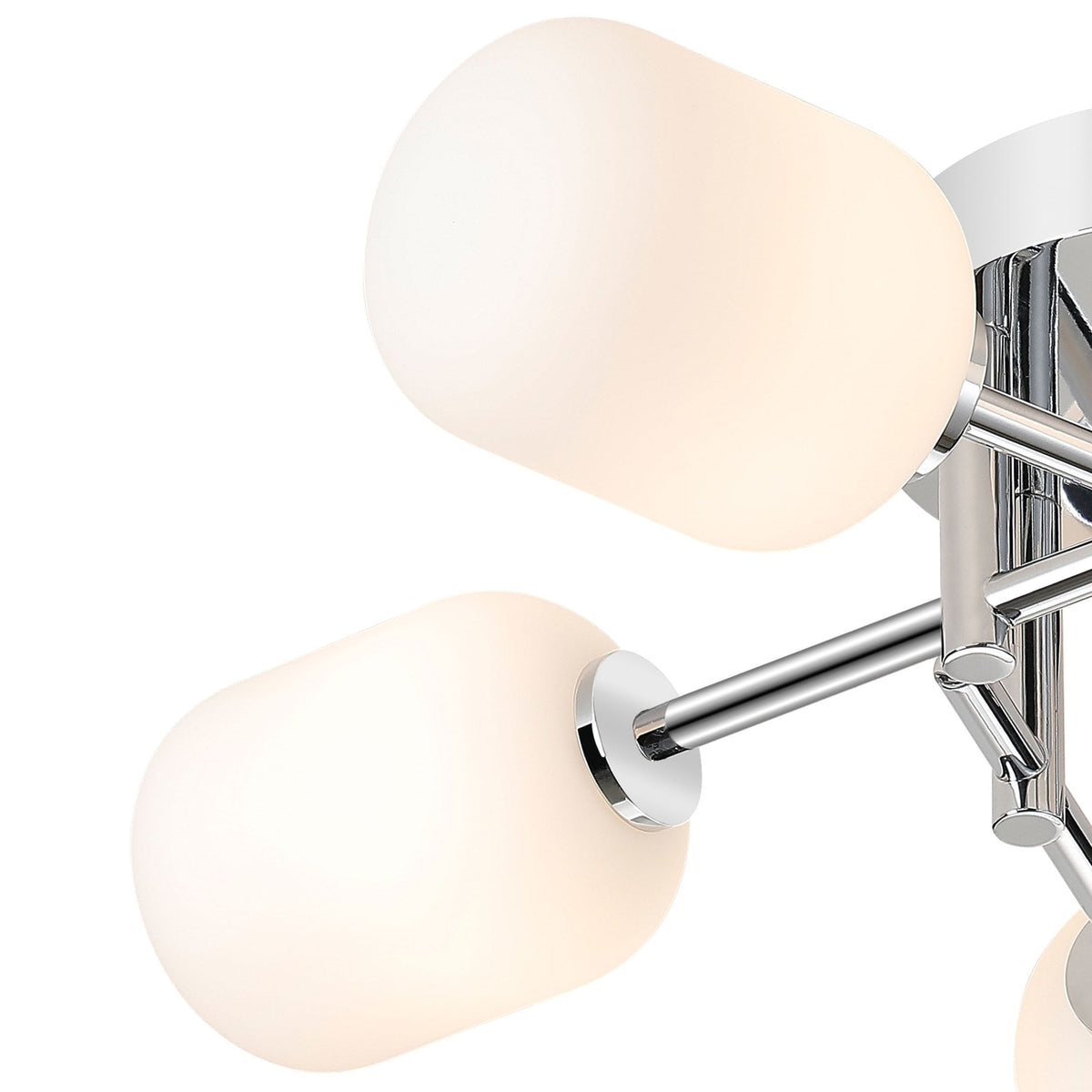 A close-up of two illuminated white glass shades and chrome arms of the light fixture.