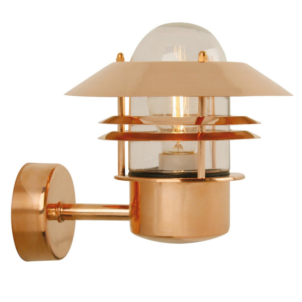 A close-up shot of a copper outdoor wall light with a glass dome and tiered shades.