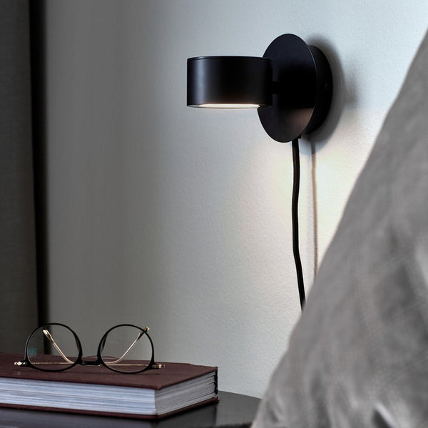 Clyde LED Plugged Adjustable Wall Light in Black