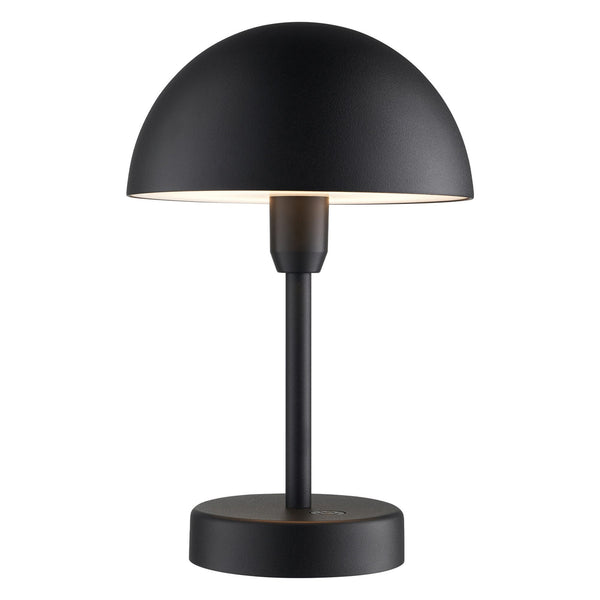 A black portable lamp with a mushroom-shaped shade and a light glowing underneath it.