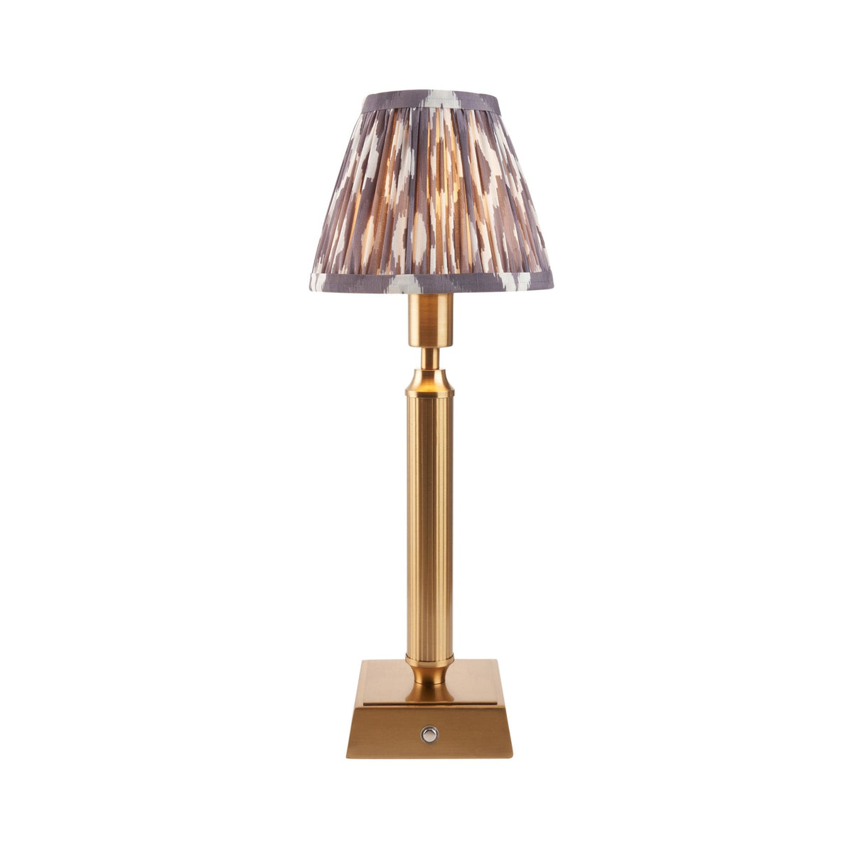 A rechargeable table lamp with a patterned ikat shade on a white background.