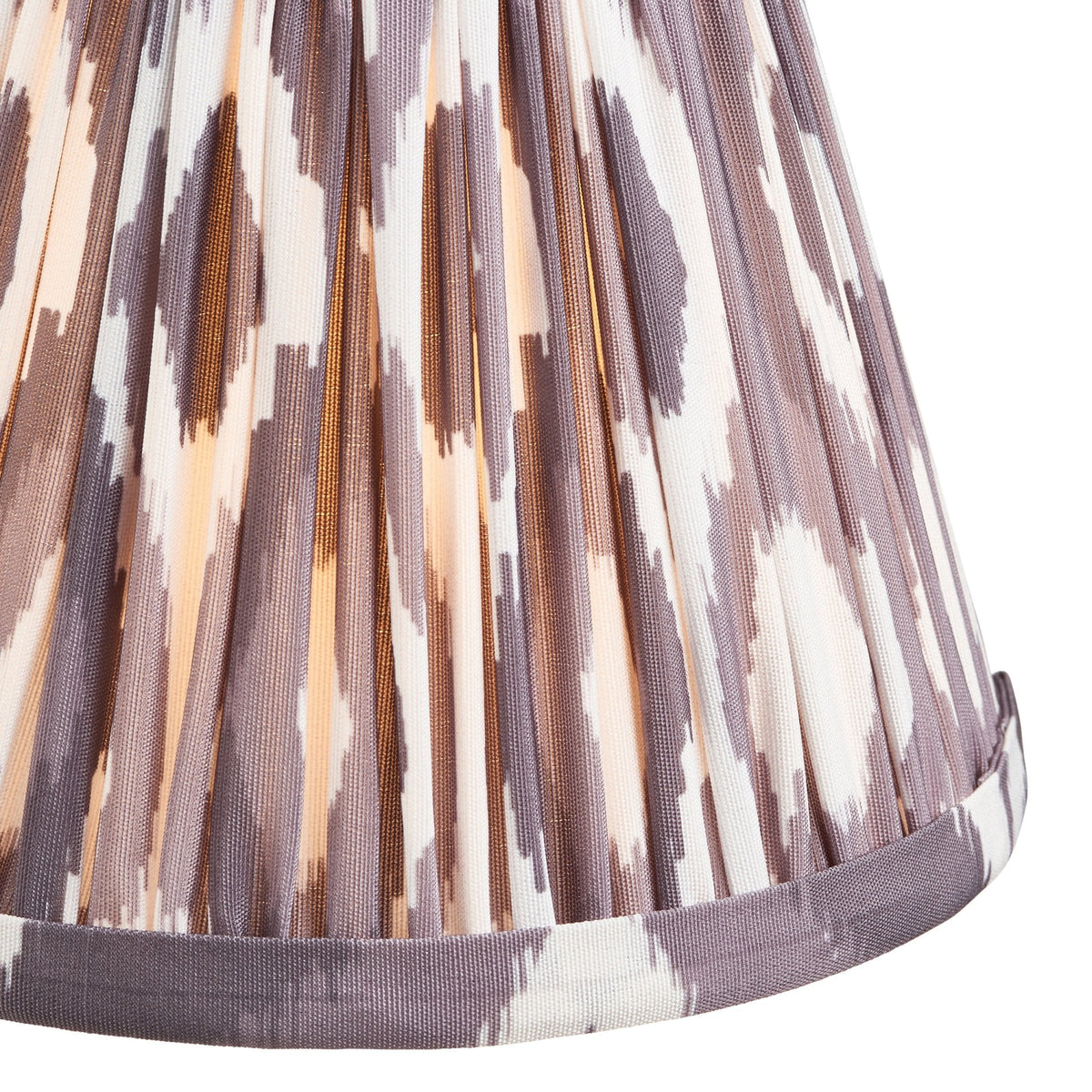 Close-up of the pleats and pattern on a patterned ikat lamp shade.