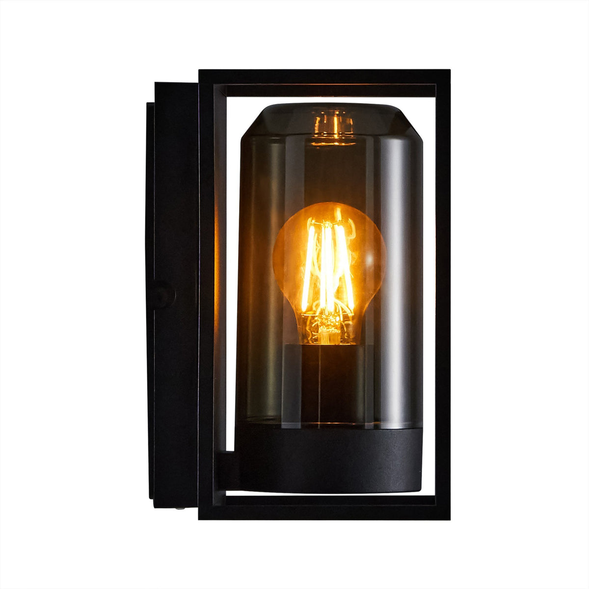 A close-up of a black outdoor wall light showing the glowing filament bulb.