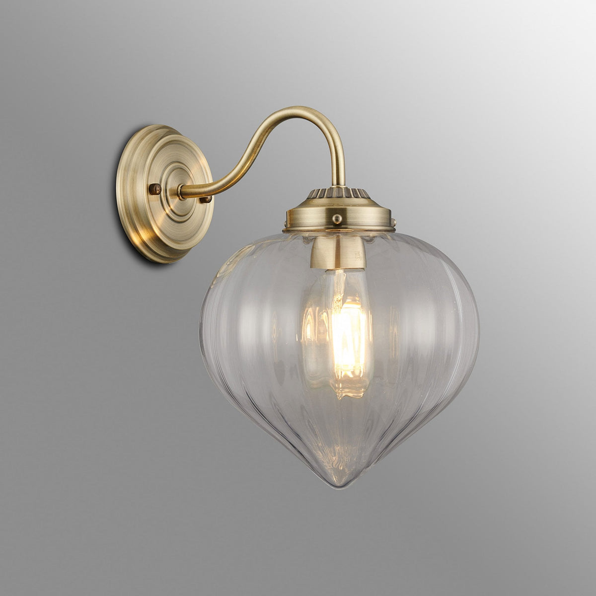 Appin Wall Light in Antique Brass with Clear Flower Bud Glass Shade