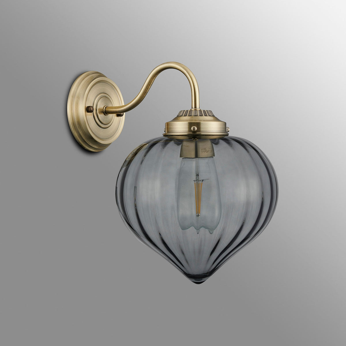 Appin Wall Light in Antique Brass with Smoke Flower Bud Glass Shade