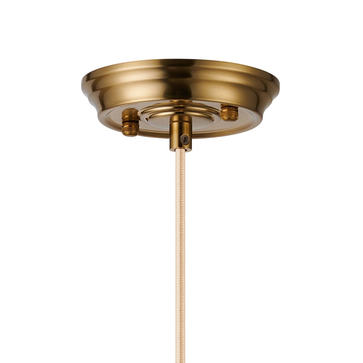 A close up of the brass ceiling rose and textile cable connection.
