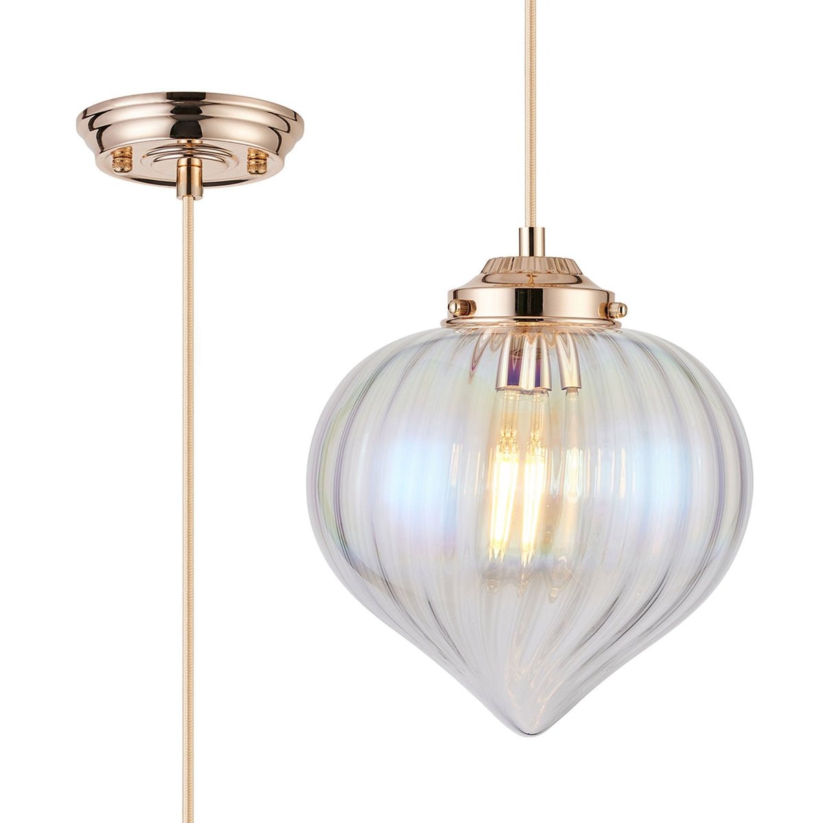 A close-up of the pendant light, highlighting the iridescent glass shade and rose gold fitting.
