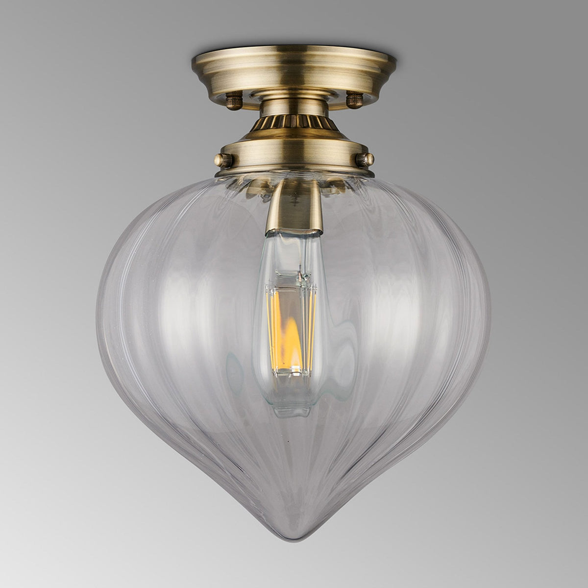 Appin Flush Ceiling Light in Antique Brass with Clear Flower Bud Glass Shade