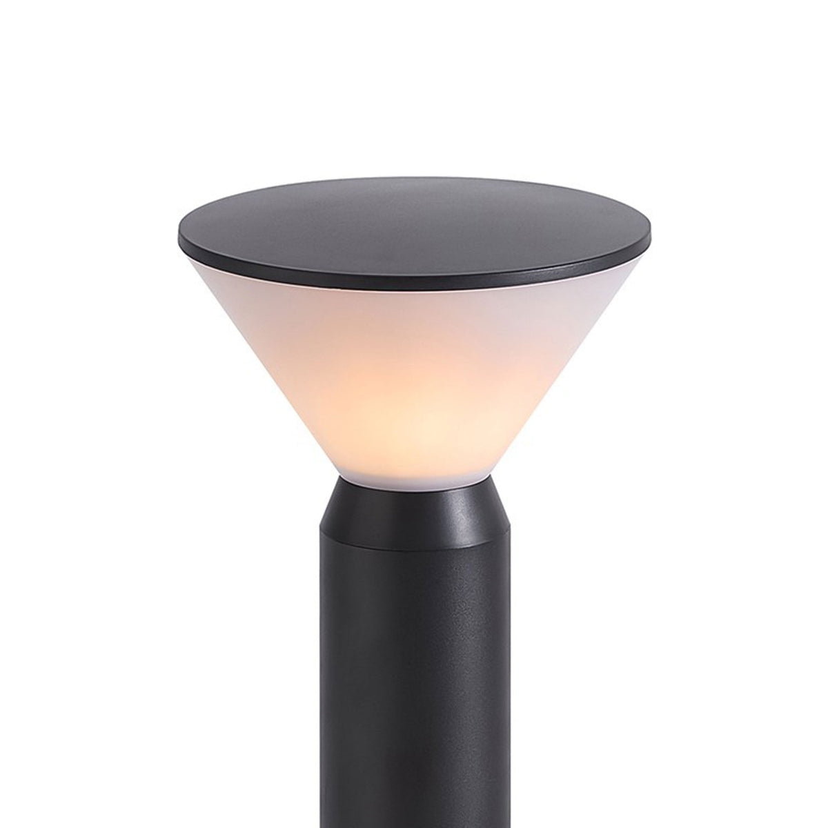 Close-up of the bollard light's conical diffuser, showing the warm light emitted.
