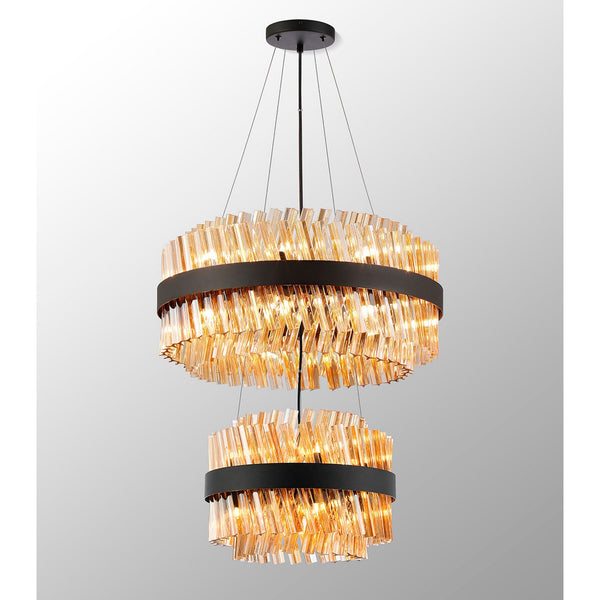 A modern two-tier chandelier with amber glass rods arranged horizontally around a black band.