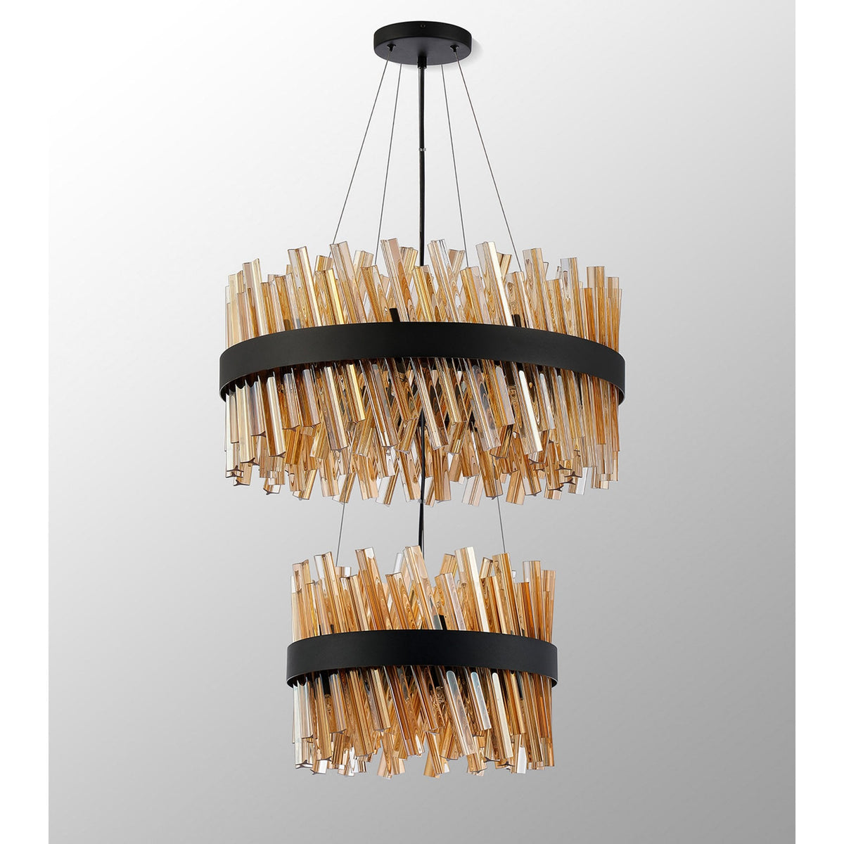 A modern two-tier chandelier with amber glass rods angled downwards around a black band.