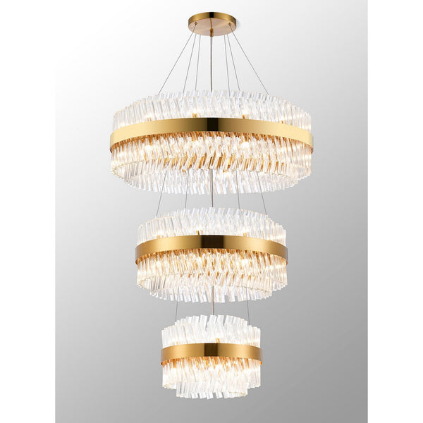 A luxurious tiered chandelier with golden bands and clear, textured glass rods in various lengths.