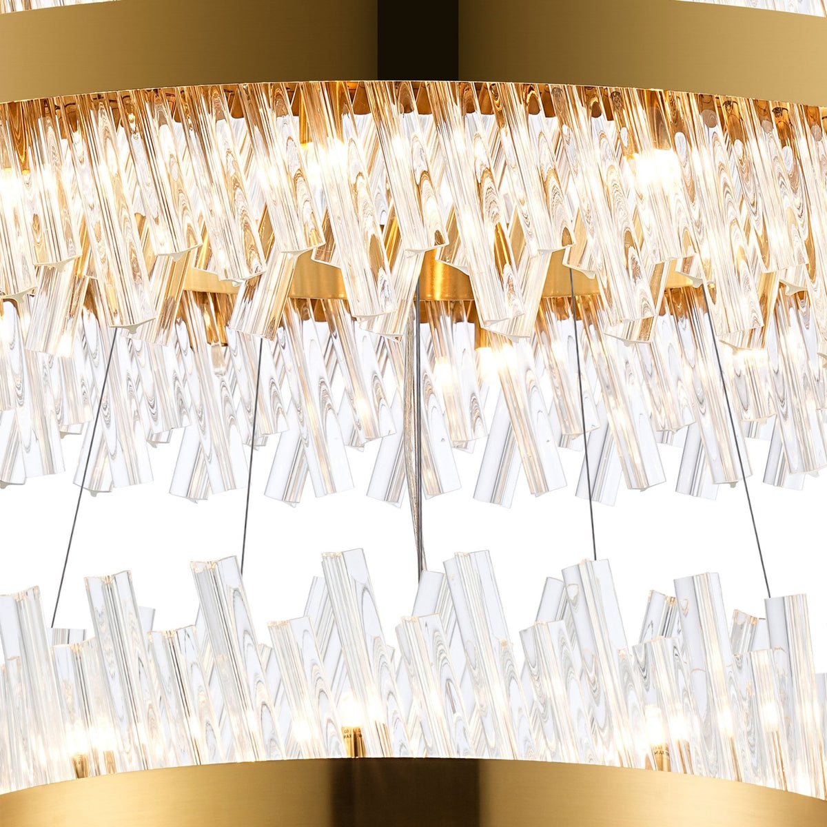 Close-up of the chandelier's middle and lower tiers, showing the clear glass rods and gold accents.