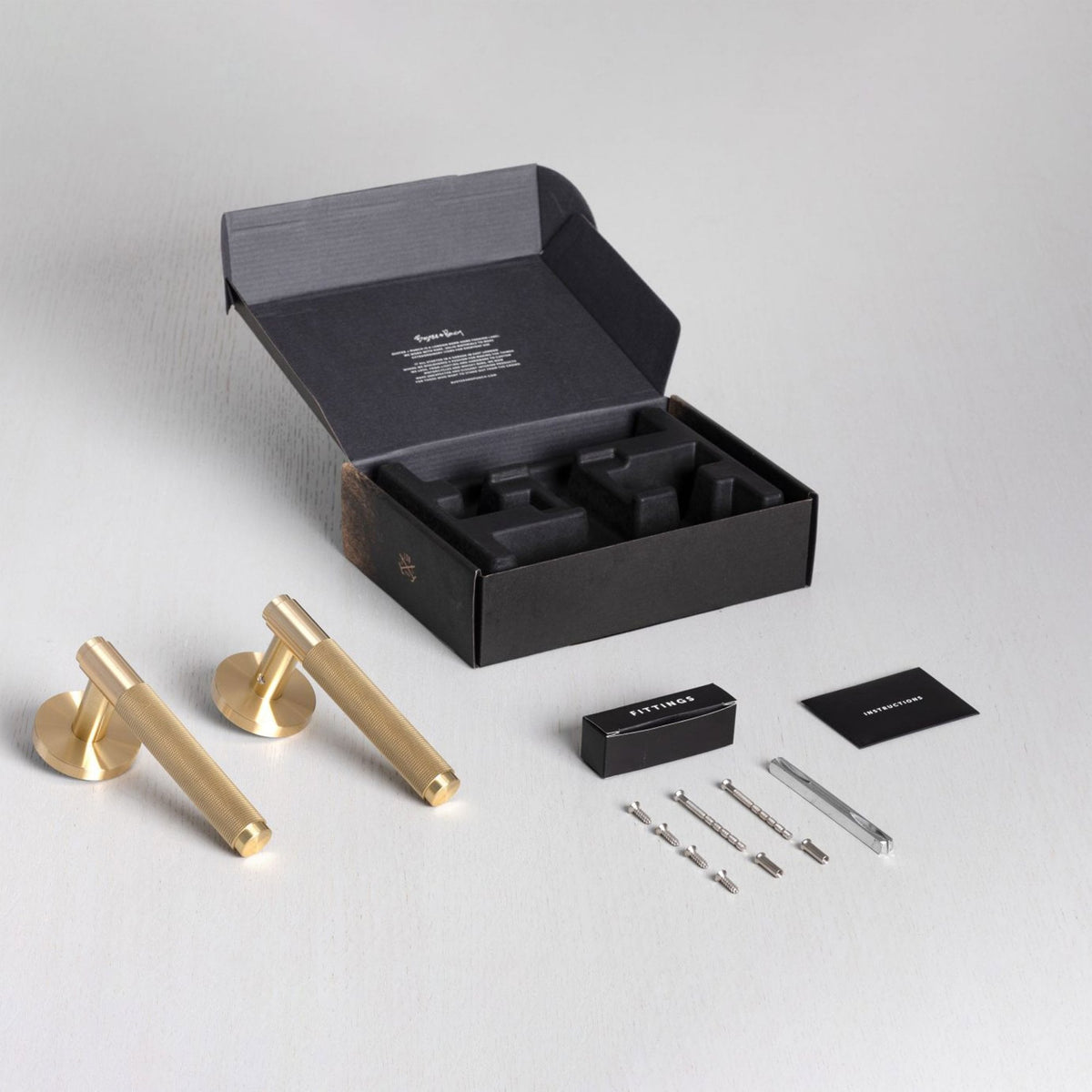 Cross Cut Knurled Door Handle Set In Brass