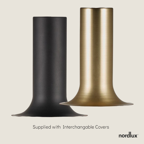 Two interchangeable pendant light covers, one black and one brass, on a light background.