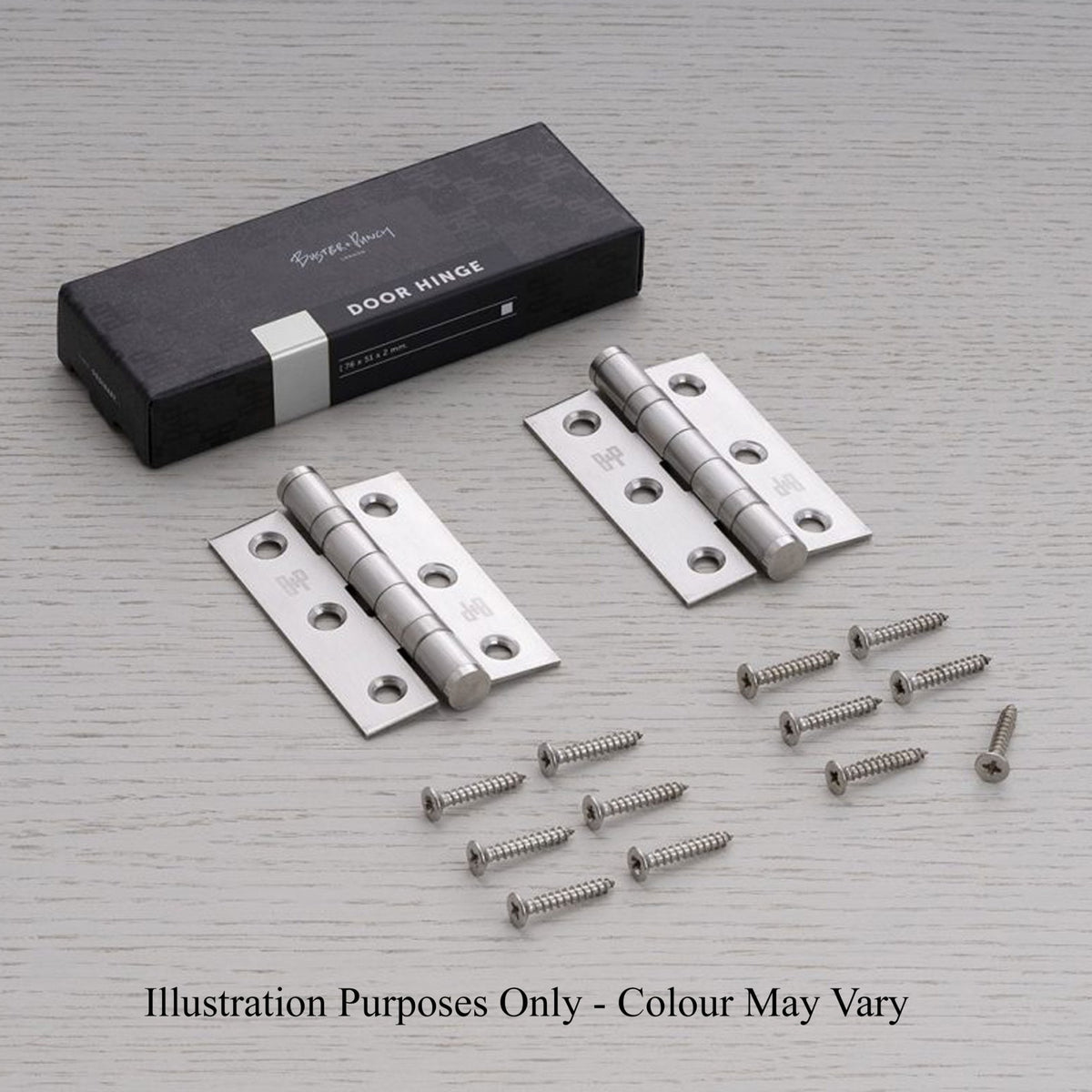 Two satin stainless steel hinges, screws, and product packaging on a light surface.
