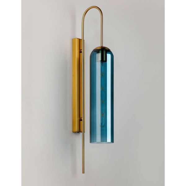 A modern brass and blue glass wall light, unilluminated against a white background.