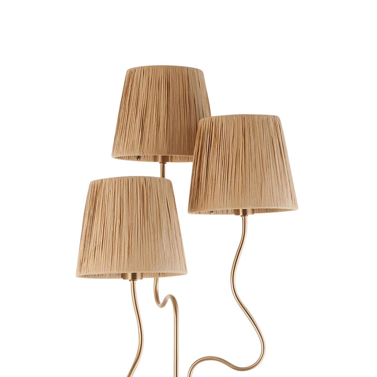 Close-up of the three pleated raffia lamp shades on a brass floor lamp, showing their textured detail.