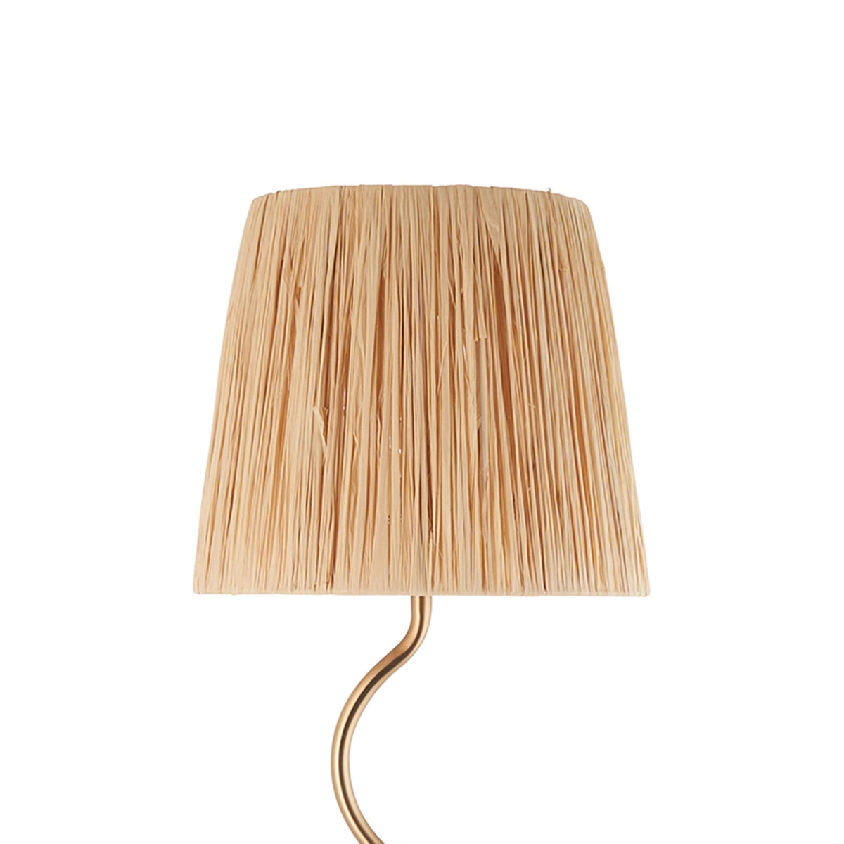 Close-up of the pleated beige shade of a floor lamp with a wavy gold stand.