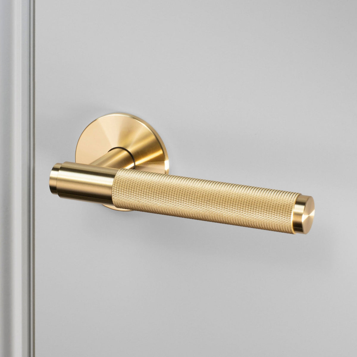 Cross Cut Knurled Single Fixed Door Handle In Brass