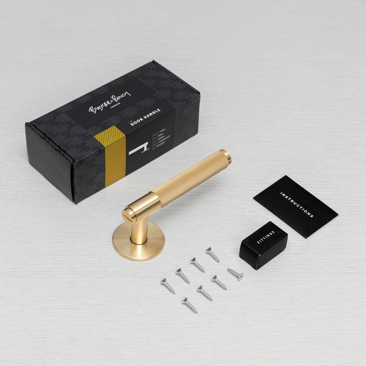 Cross Cut Knurled Single Fixed Door Handle In Brass