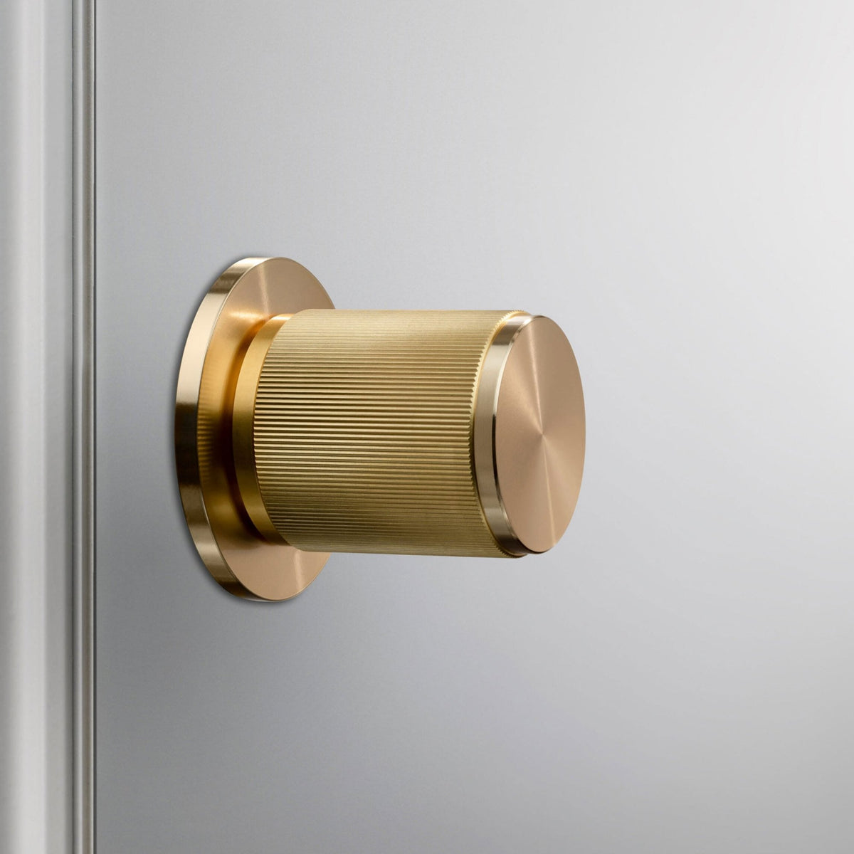 Linear Knurled Fixed Double Sided Door Knob In Brass