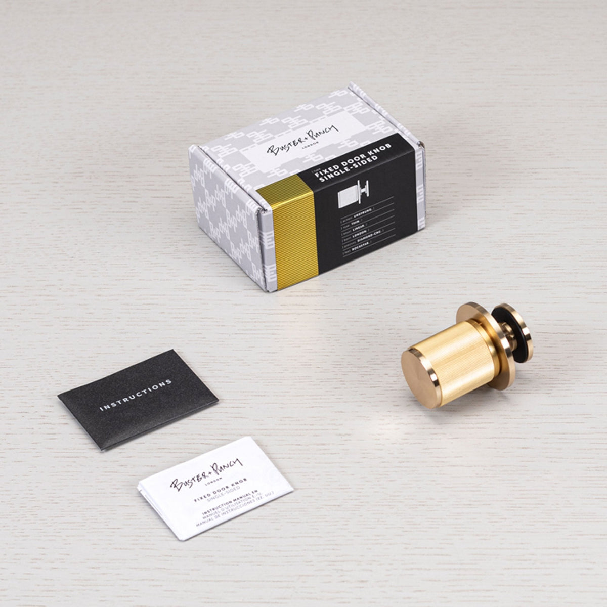 Linear Knurled Fixed Single Sided Door Knob In Brass