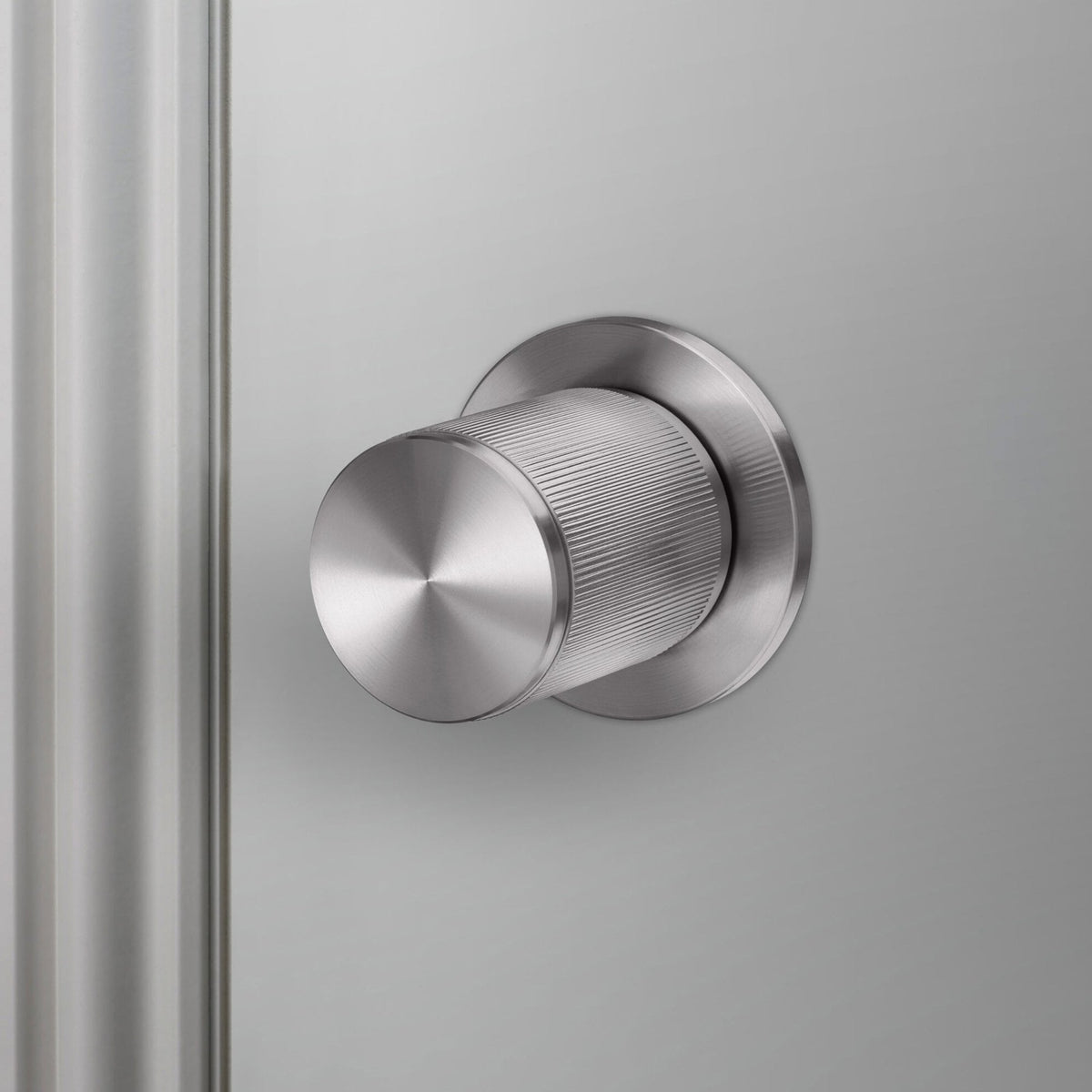 Linear Knurled Fixed Single Sided Door Knob In Steel