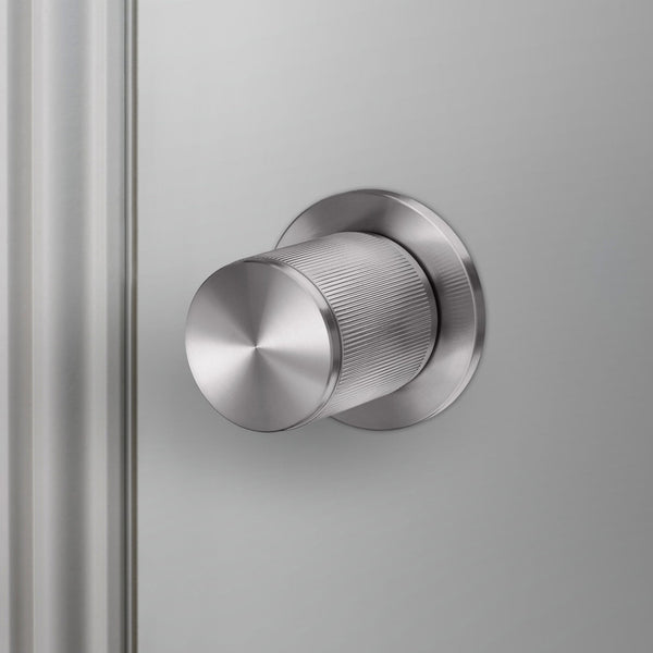 Linear Knurled Fixed Single Sided Door Knob In Steel