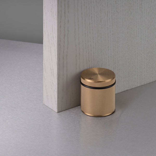 Free Standing Linear Knurled Door Stop In Brass