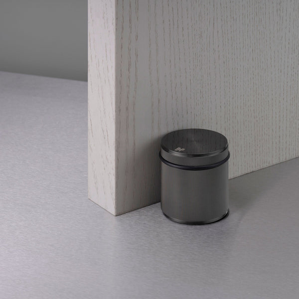 Free Standing Linear Knurled Door Stop In Gun Metal Grey