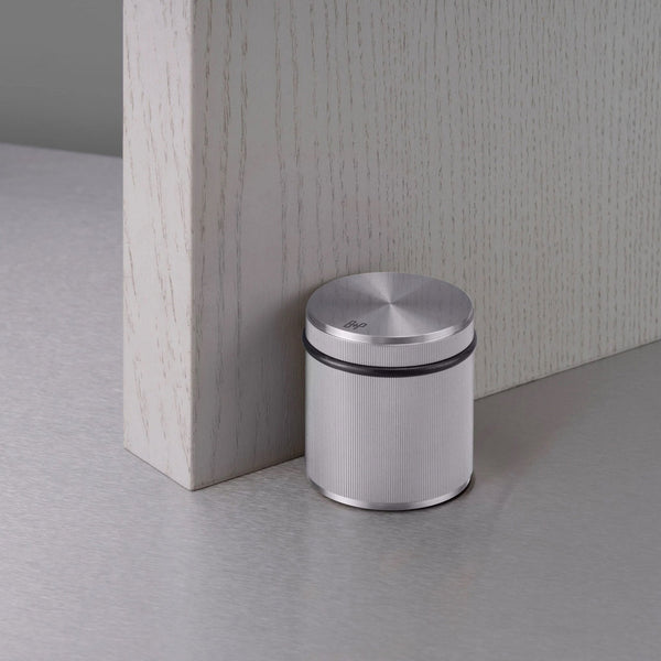 Free Standing Linear Knurled Door Stop In Steel