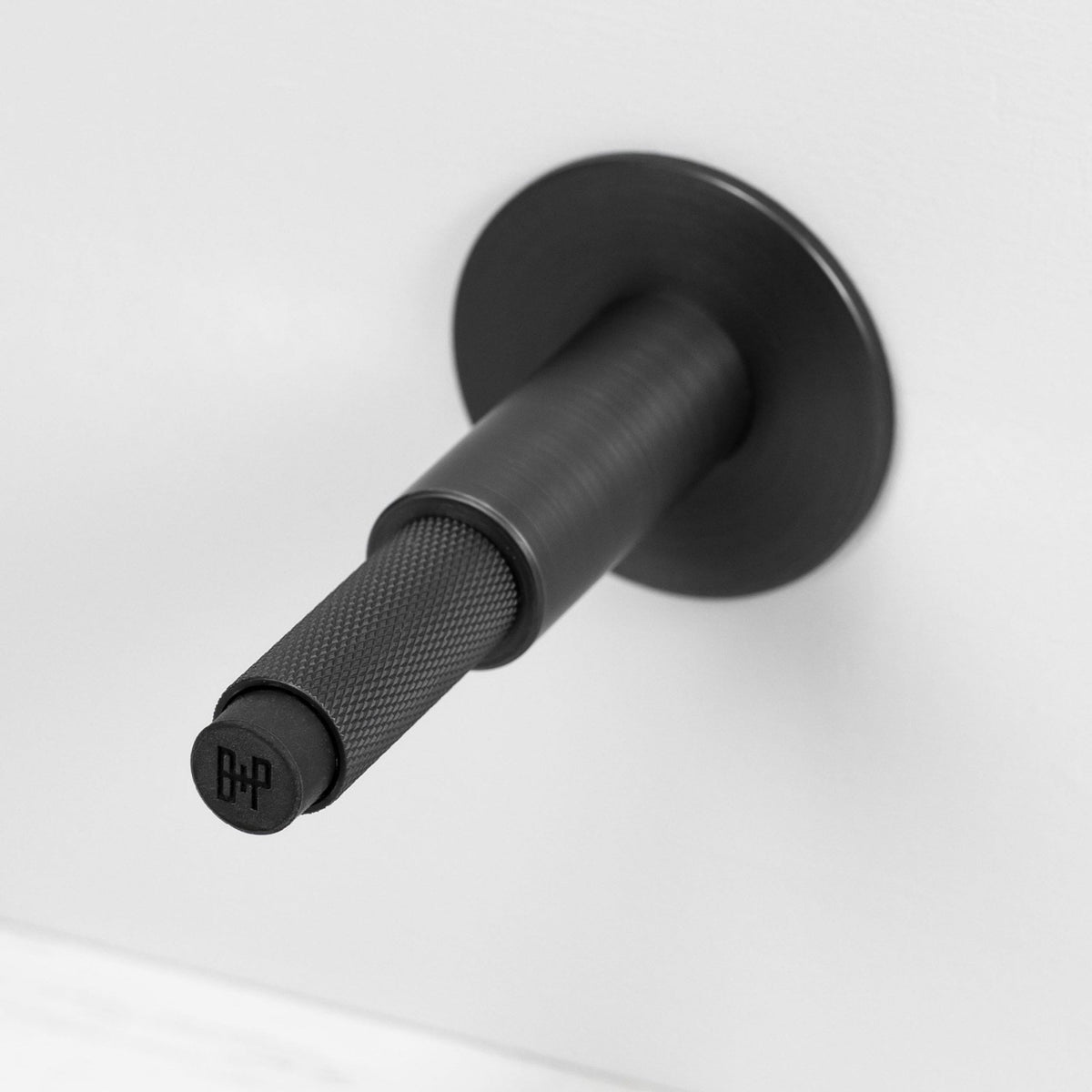 Cross Cut Knurled Wall Mounted Door Stop in Smoked Bronze