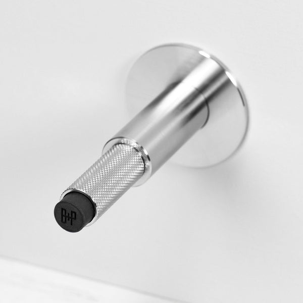 Cross Cut Knurled Wall Mounted Door Stop in Steel