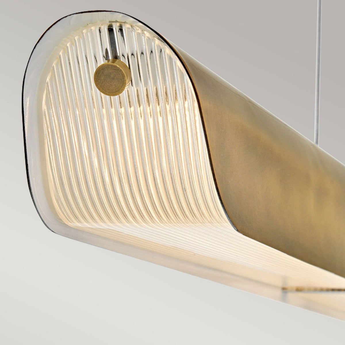 Arco Linear LED Linear Pendant in Heritage Brass Finish with Clear Ribbed Glass