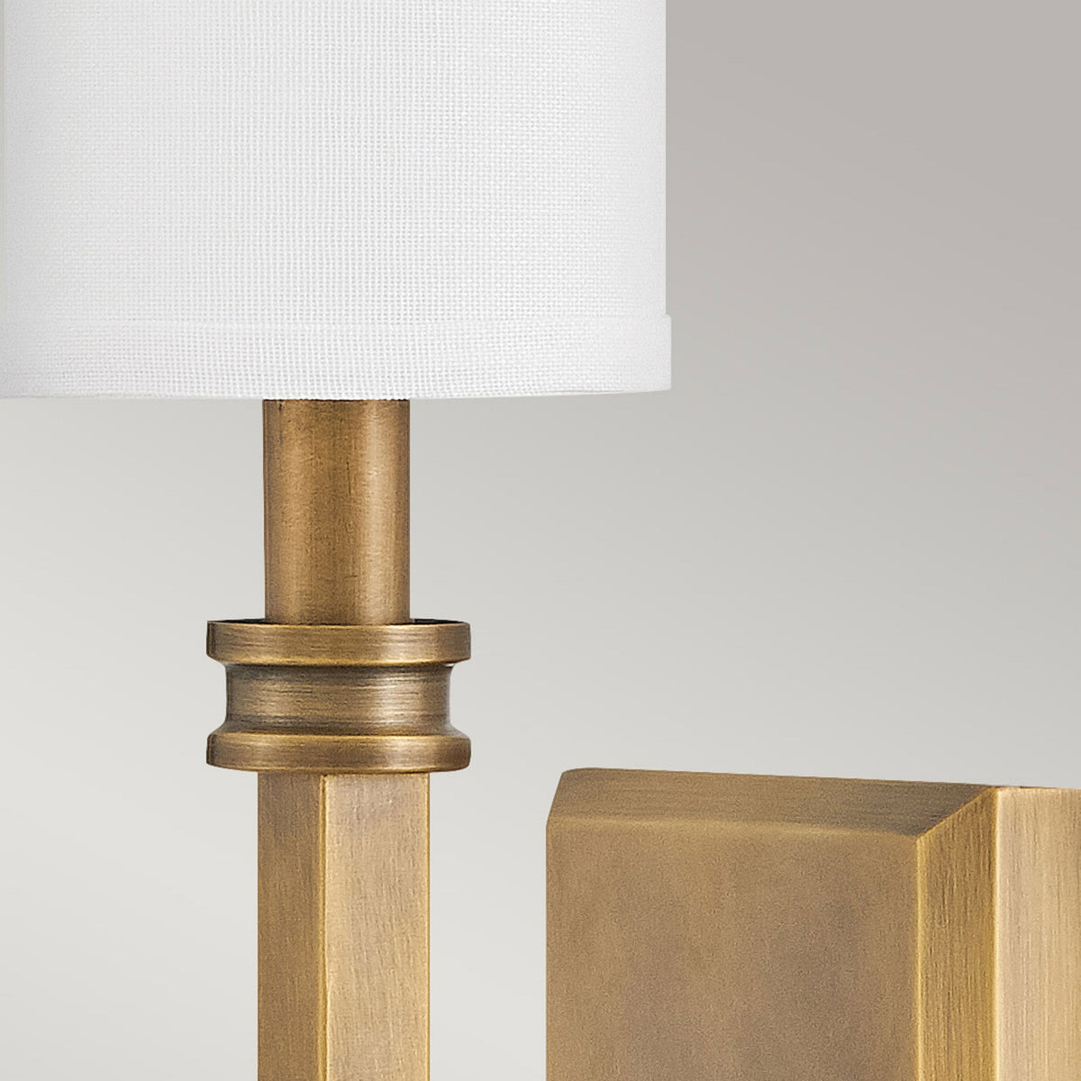 Moore Single Wall Light in Heritage Brass with Ivory Linen Shade
